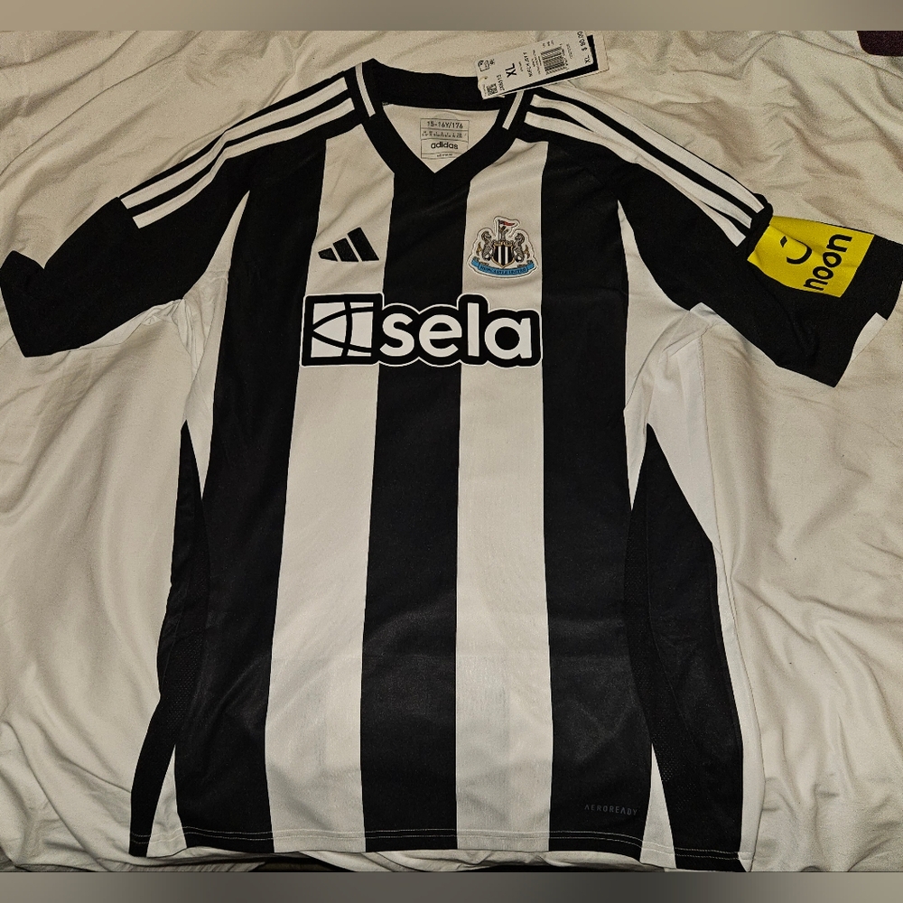 New Adidas Youth Newcastle home jersey. XL